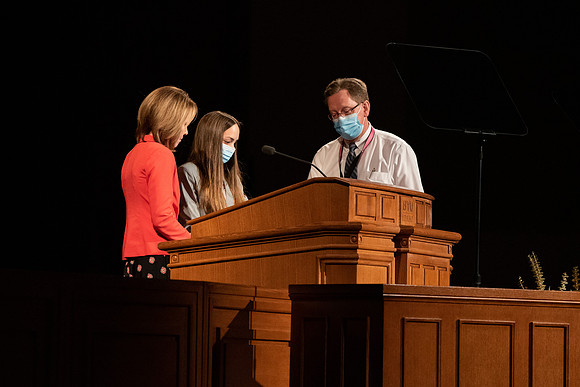 Amanda Kingsford speaks in devotional to an empty auditorium due to Covid-19 restrictions.