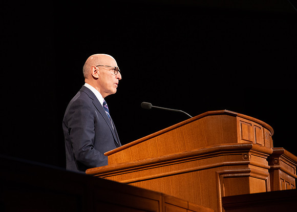 Elder Arnulfo Valenzuela giving a speech at the devotional.