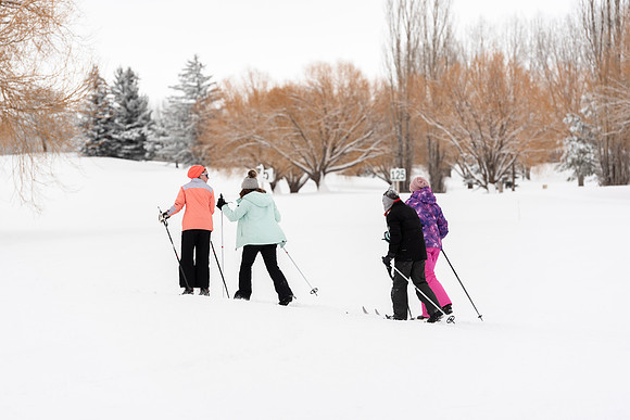 Volunteers and Community members enjoying Winter Fest at the Teton Lakes Golf Course.