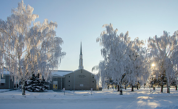 The Church of Jesus Christ of Latter Day Saints old gray church house in Sugar City, Idaho on a frosty winter day.