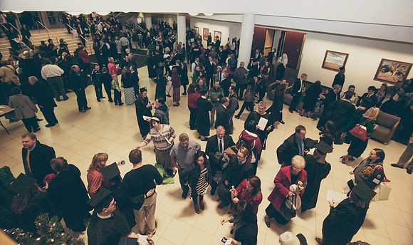 Graduates and family gather outside the I-Center after Commencement to mingle before Convocation.