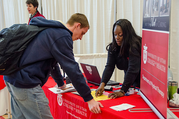 BYU-Idaho students speak to representatives from colleges or companies from their field of study at a career fair held in the I-Center gym