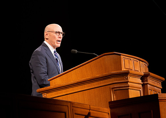 Elder Arnulfo Valenzuela giving a speech at the devotional.