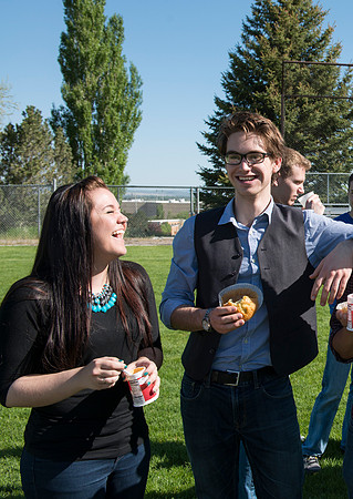 Student models interact and smile for marketing purposes that will be used for the new Campus Housing next to The Ivy.