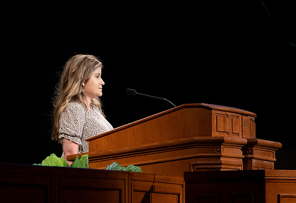 BYU-I student sharing a scripture at devotional.