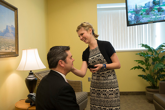 Behind the scenes of devotional, the speaker, Drew Eader, gets a little powder to reduce the shine from the bright lights.