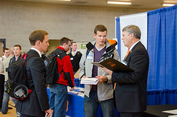 BYU-Idaho students speak to representatives from colleges or companies from their field of study at a career fair held in the I-Center gym