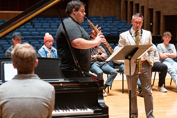Members of the United States Marine Band work with students in a Masters class.