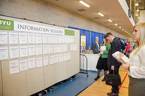BYU-Idaho students look at the information sessions at a career fair held in the I-Center gym