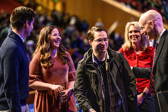 Participants chat after devotional, held in the BYU-Idaho Center.