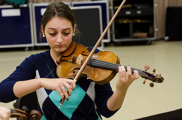 A member of the Shanghai String Quartet working with student ensembles.