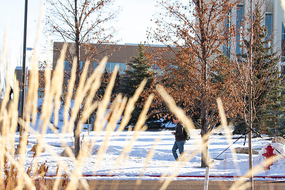 A student passes by the Taylor Building during the first week of school.