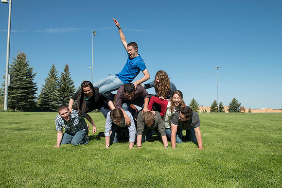 Student models interact and smile for marketing purposes that will be used for the new Campus Housing next to The Ivy.