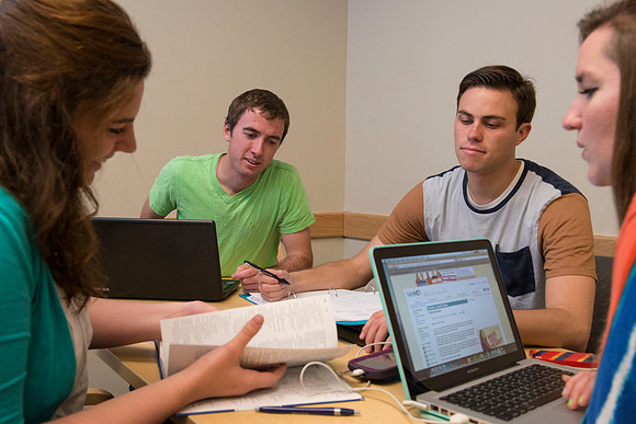 Students engage in an active study group for the new housing promo pictures.