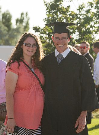 Graduates meet outside on the BYU-Idaho campus after commencement to take pictures before convocation starts.