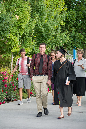 Faculty, family and graduates around campus after the commencement ceremony.