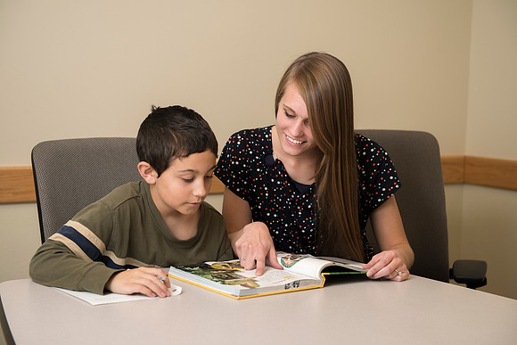 Teacher Education students offer their services tutoring kids 3rd grade to 12th grade. Hannah Paget tutoring Jaden Davis.