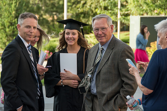 Faculty, family and graduates around campus after the commencement ceremony.
