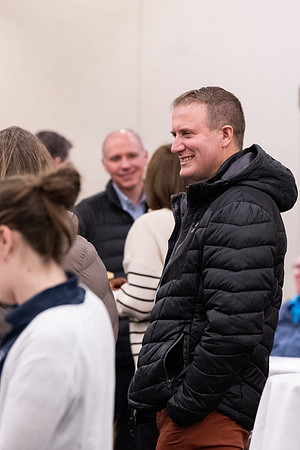 Employees gather for the annual Christmas gathering with President and Sister Meredith.