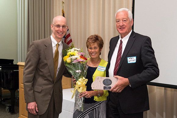 Alumni of the class of 1964 and earlier gather and honor Kay and Cheryl Briggs with the Alumni Award of Excellence for their service.