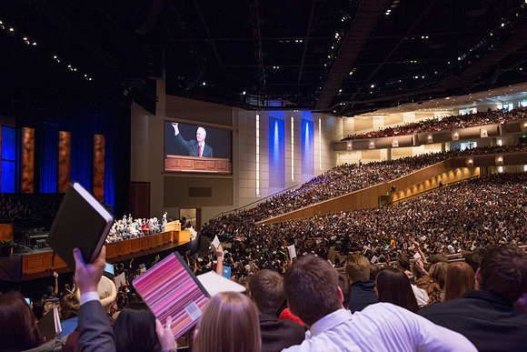 Students raise their scripture to show their readiness to learn.