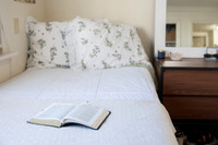 Scriptures on a desk in a clean student bedroom