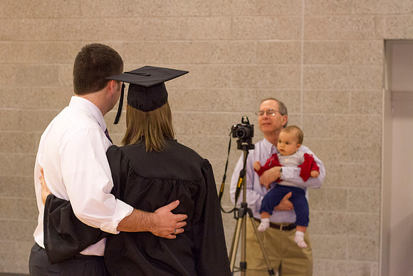 Graduates and family gather outside the I-Center after Commencement to mingle before Convocation.