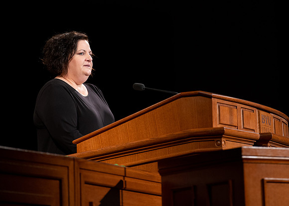 Sister Jacquel Fluckiger giving a talk during devotional.