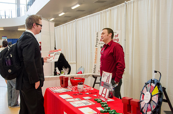 BYU-Idaho students speak to representatives from colleges or companies from their field of study at a career fair held in the I-Center gym