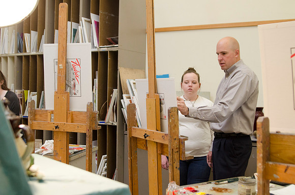 David Belka enthusiatically teaches painting principles to beginning painting class.