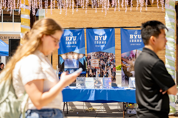 Spirit Fest Booths on campus, students talking and having fun together.