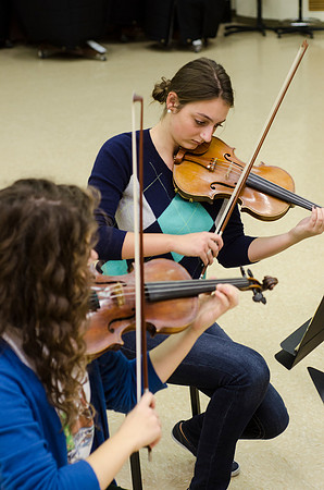 A member of the Shanghai String Quartet working with student ensembles.