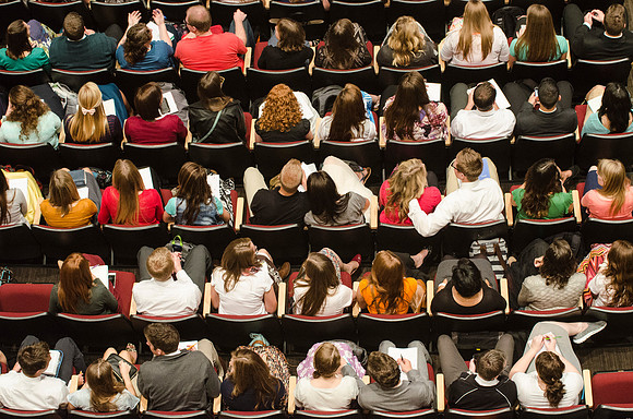 Students gather in the BYU-Idaho Center for devotional to listen to Elder Holland.