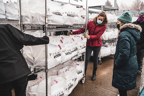 Students help distribute meals for a campus wide break the fast.