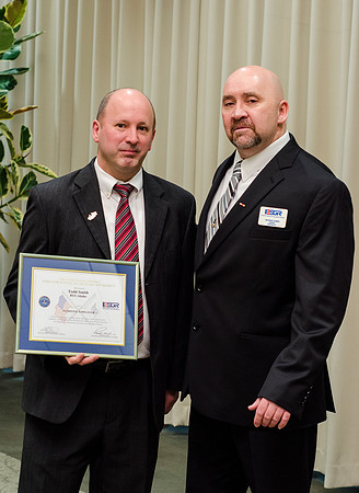 Todd Smith receiving an award on behalf of BYU-Idaho from the Office of the Secretary of Defense for the support BYU-Idaho has given to Peter Stilling while he has been serving in the Guard. Awarded b