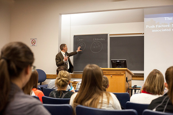 Brother Michael Madsen teaches his early morning Geography For Elementary Teachers class in the Ricks Building.
