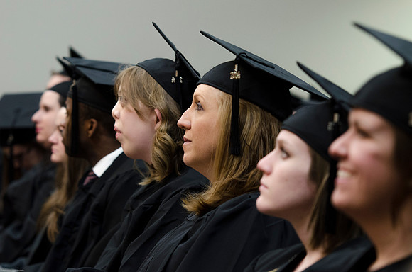 Student Graduates at the College of Education and Human Development Convocation in the HInckley Chapel.