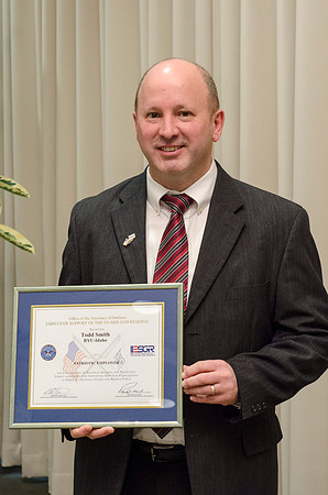 Todd Smith receiving an award on behalf of BYU-Idaho from the Office of the Secretary of Defense for the support BYU-Idaho has given to Peter Stilling while he has been serving in the Guard. Awarded b