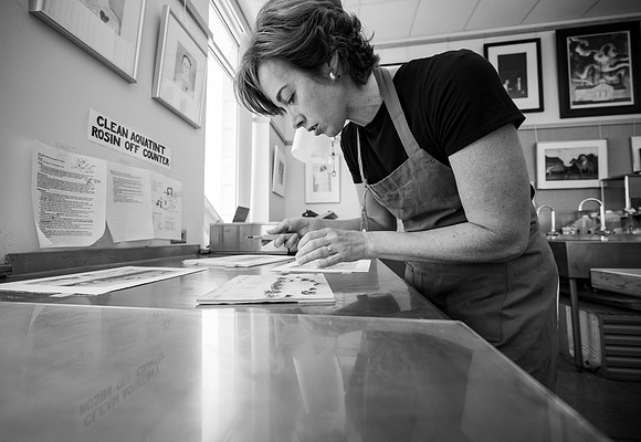 Students working in Printmaking 2 in the Spori Building.