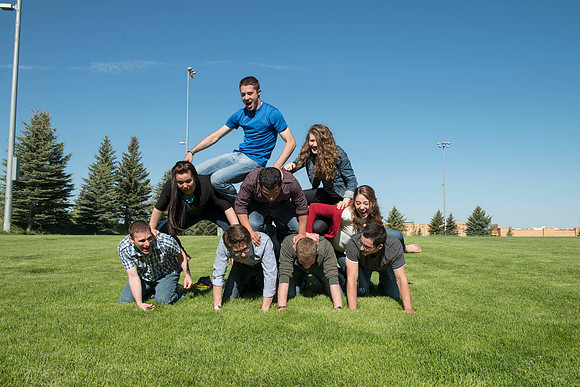 Student models interact and smile for marketing purposes that will be used for the new Campus Housing next to The Ivy.