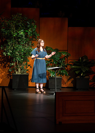 BYU-I student conducting a hymn during devotional.