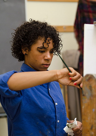 David Belka enthusiatically teaches painting principles to beginning painting class.