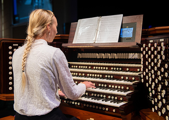 Organist playing at the devotional.