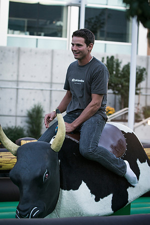 Students test their ability to stay on top of a mechanical bull during the BYU-Idaho i-Night Extavaganza.