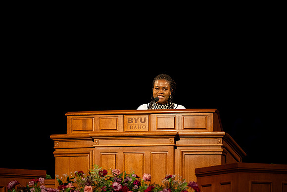 Elder Egbo speaking to students in the BYUI Center.