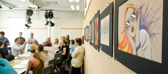 Wade Hunstman gives a demonstration to art students.