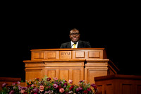Elder Egbo speaking to students in the BYUI Center.