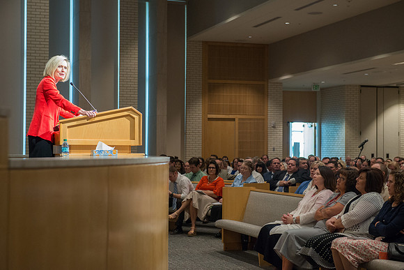 Sister Bonnie Cordon in the General Young Women's Presidency addresses Employees gathered in the Taylor Chapel.