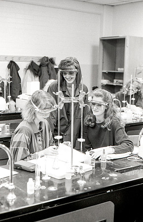 Chemistry teacher, Susan Ward, works with students during their Chemistry lab. December 1995.