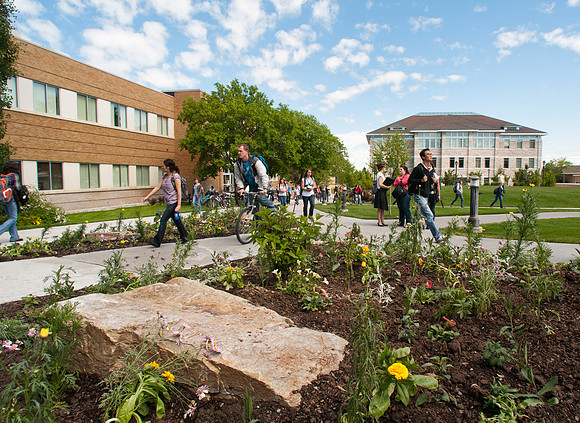 Students walking between classes during the spring semester in the Spori Quad.